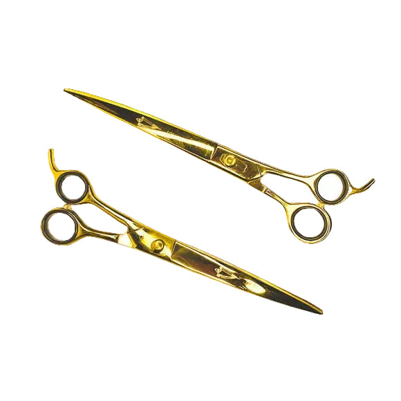 Pair of gold scissors on a white background